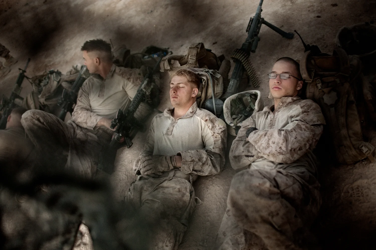 U.S. Marines rest at Combat Operations Post Coutu before a patrol in Marja District, Helmand Province, Afghanistan.