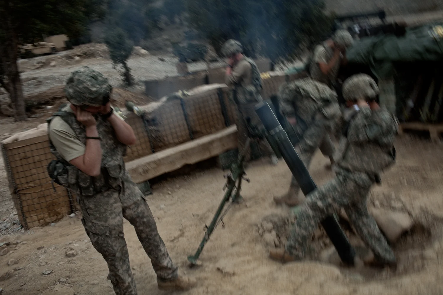 U.S. Army soldiers fire mortars to support a patrol at the Korengal Outpost, Kunar Province, Afghanistan.