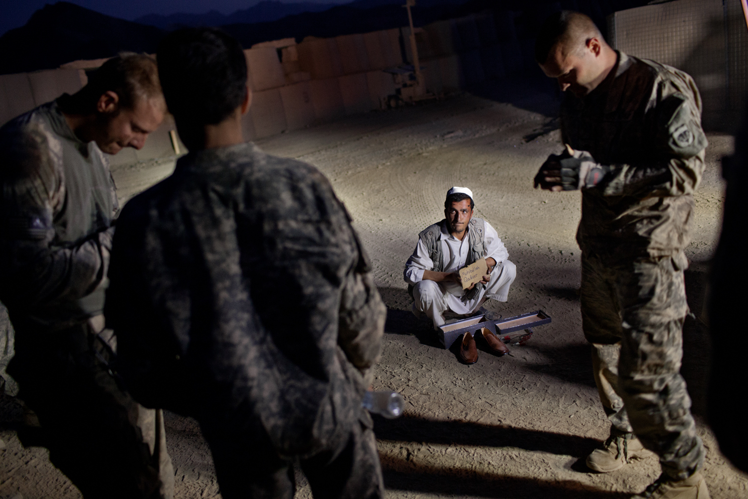  An Afghan man is detained by U.S. Army at Combat Operations Post Tangi, Wardak Province, Afghanistan.    