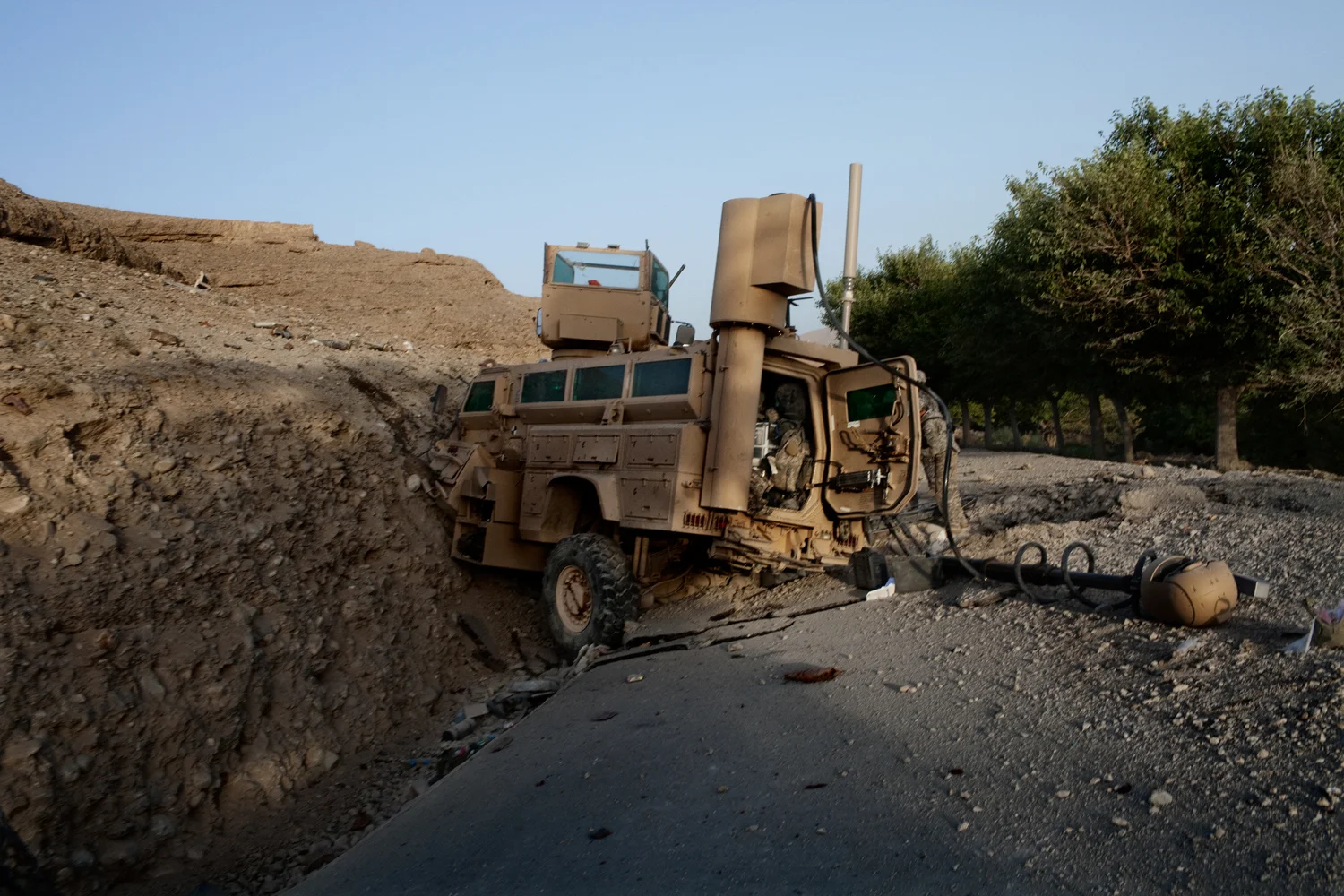A Mine Resistant Ambush Protected Vehicle sits on the road after being attacked by an improvised explosive device in the Tangi Valley, Wardak Province, Afghanistan.