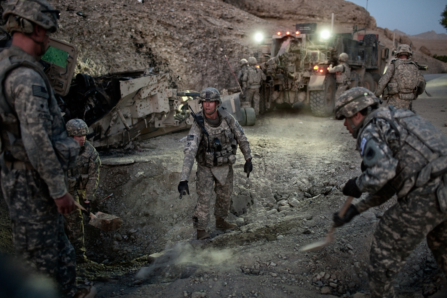  U.S. Army soldiers clear a road after an&nbsp;improvised explosive device attack on a vehicle in the Tangi Valley, Wardak Province, Afghanistan.    