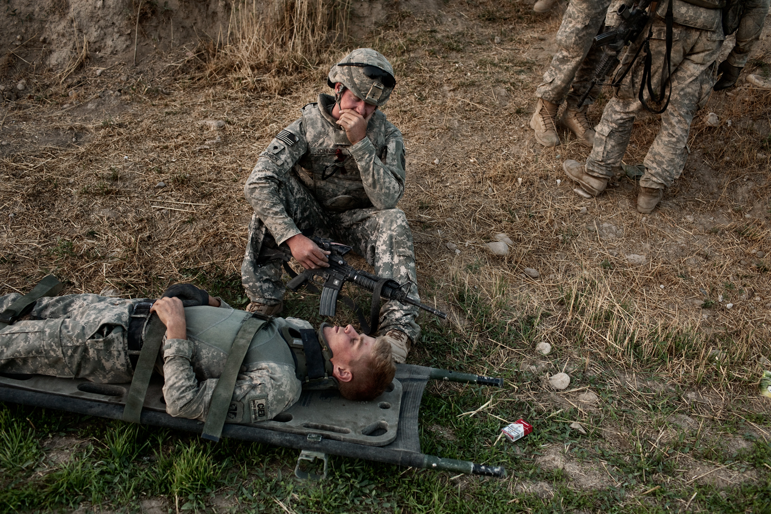  U.S. Army Specialist T.J. Fecteau lies on a stretcher after being concussed in an&nbsp;improvised explosive device attack on his vehicle in the Tangi Valley, Wardak Province, Afghanistan.    