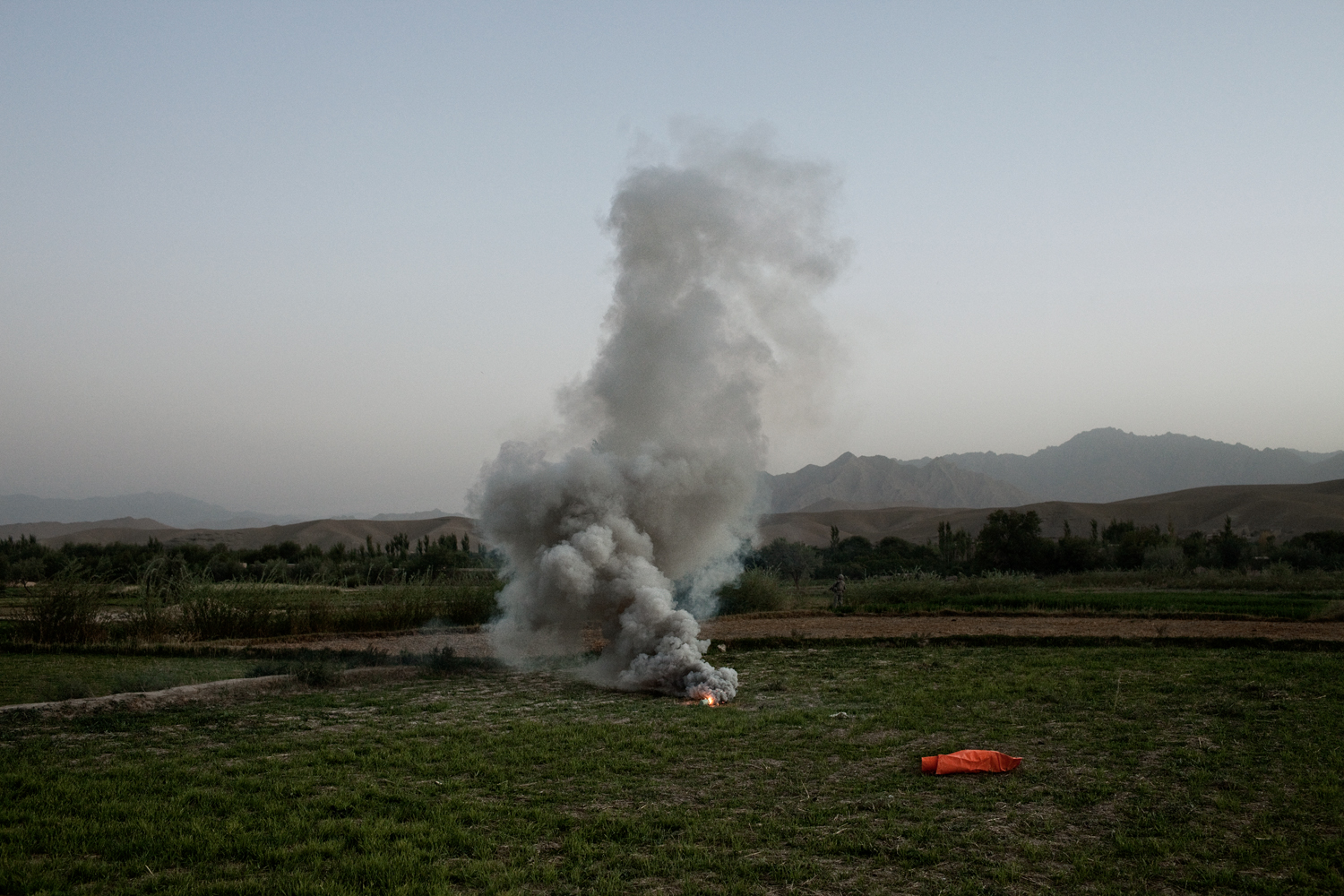  A flare marks a landing zone for medical evacuation helicopters after three U.S. Army Soldiers were injured in an improvised explosive device attack in the Tangi Valley, Wardak Province,&nbsp;Afghanistan.    