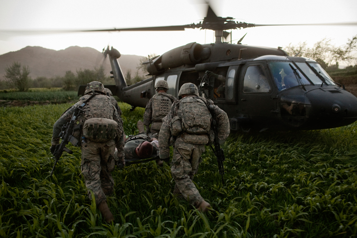  Sergeant Chet Millard is carried on a stretcher to a medical evacuation helicopter after he was injured in an improvised explosive device attack on his vehicle in the Tangi Valley, Wardak Province,&nbsp;Afghanistan. 