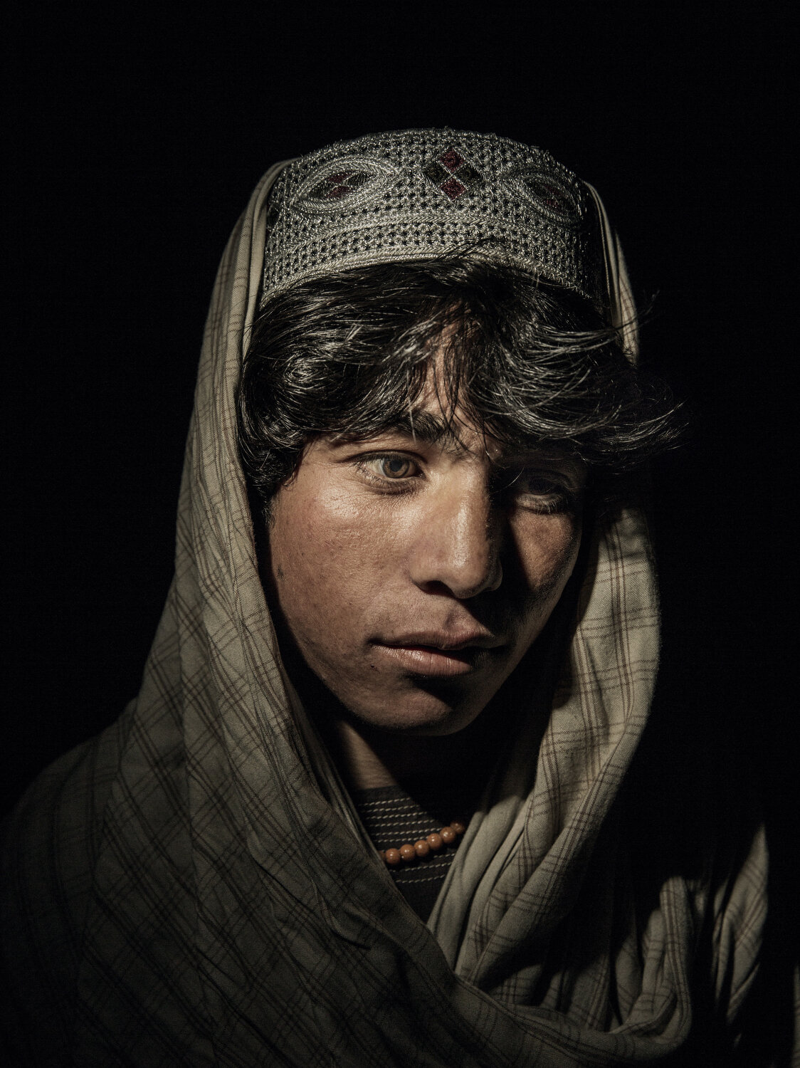  Dawar Khan, age 17 and an IDP from from Sangin District, Helmand Province, 2016. His home was hit by a mortar that killed two of his brothers, Afghanistan, 2016. 