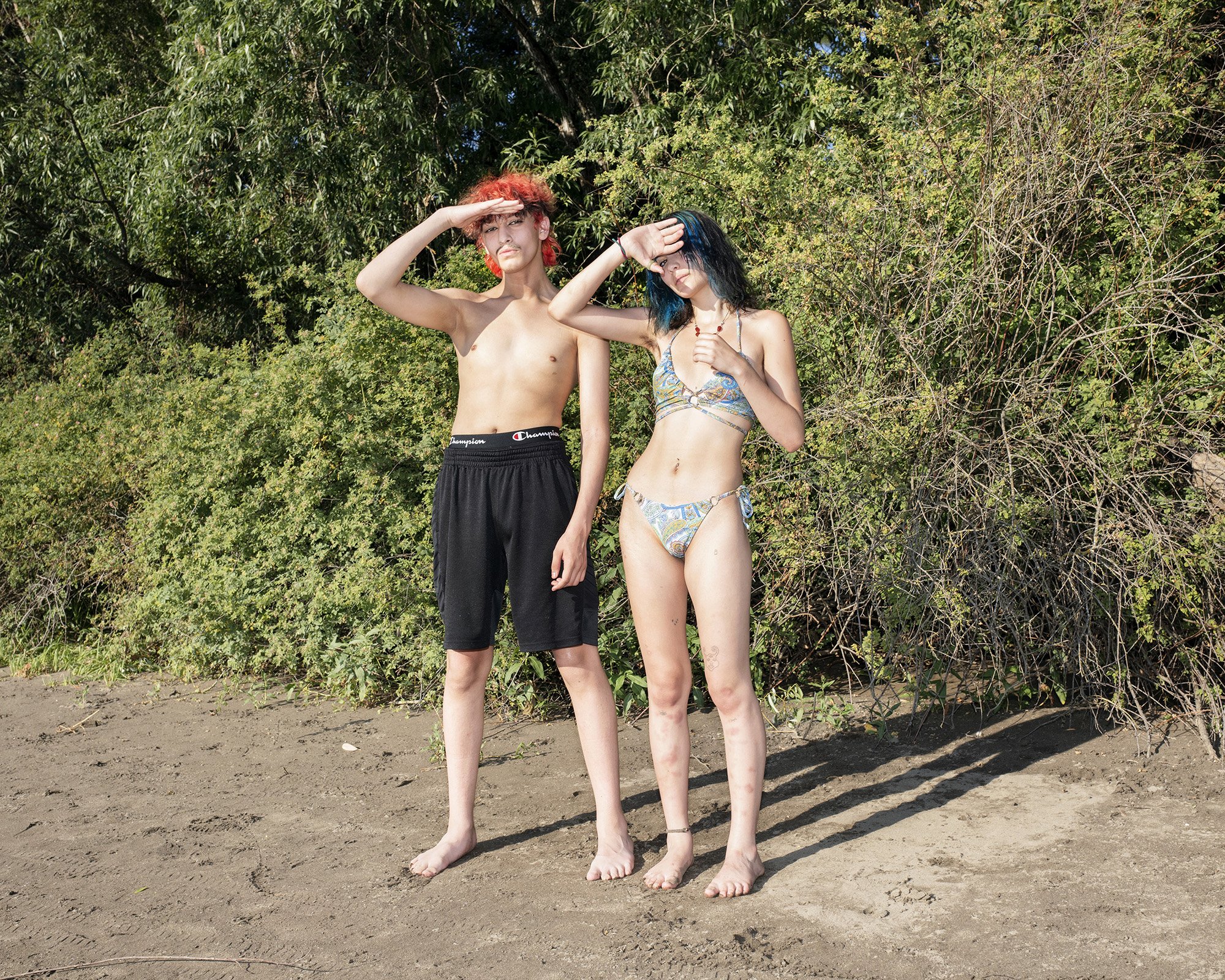  Isaiah Vankova and Sofia Zambrano, both 18, stand on the bank of the Willamette River near Sellwood Riverfront Park on June 27 in Portland, Oregon. Record-shattering heat in Portland, where that day it was hotter than Dubai, would lead to canceled s