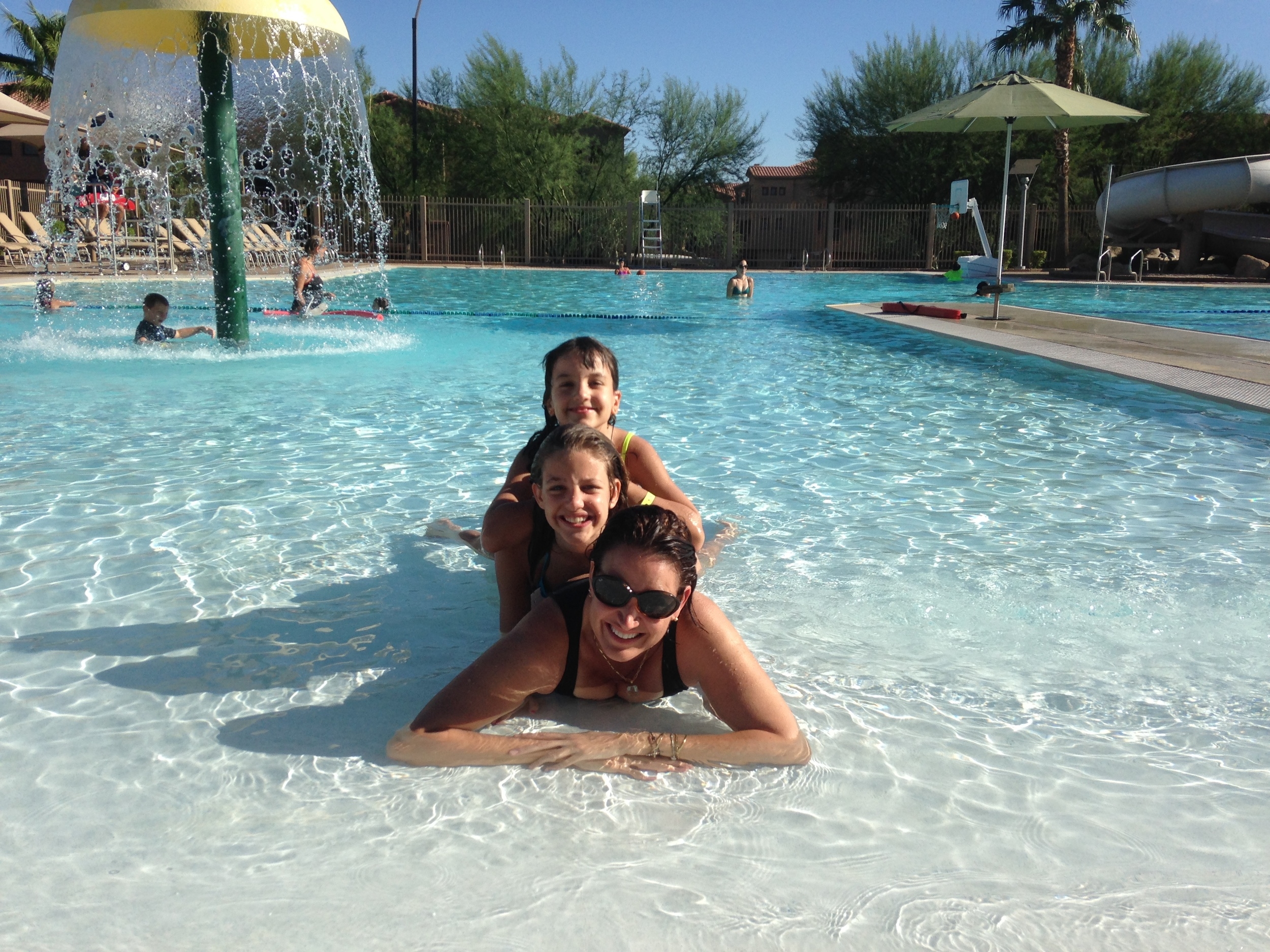 Cooling down with my daughters at the pool