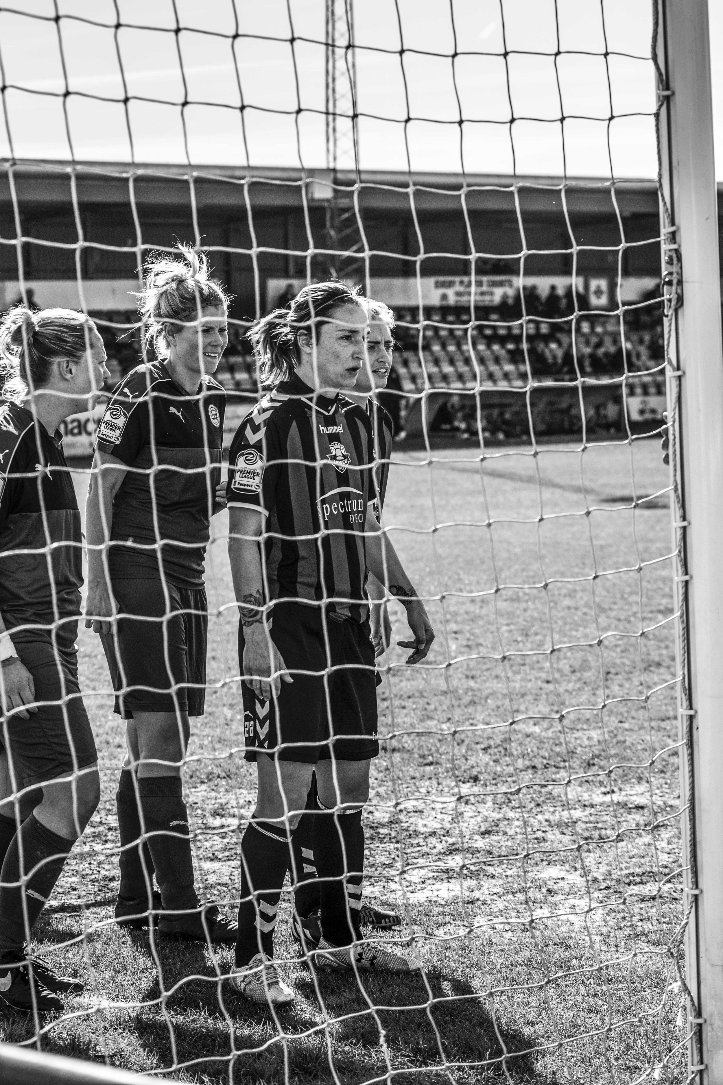 Women footballers waiting for a corner.jpg