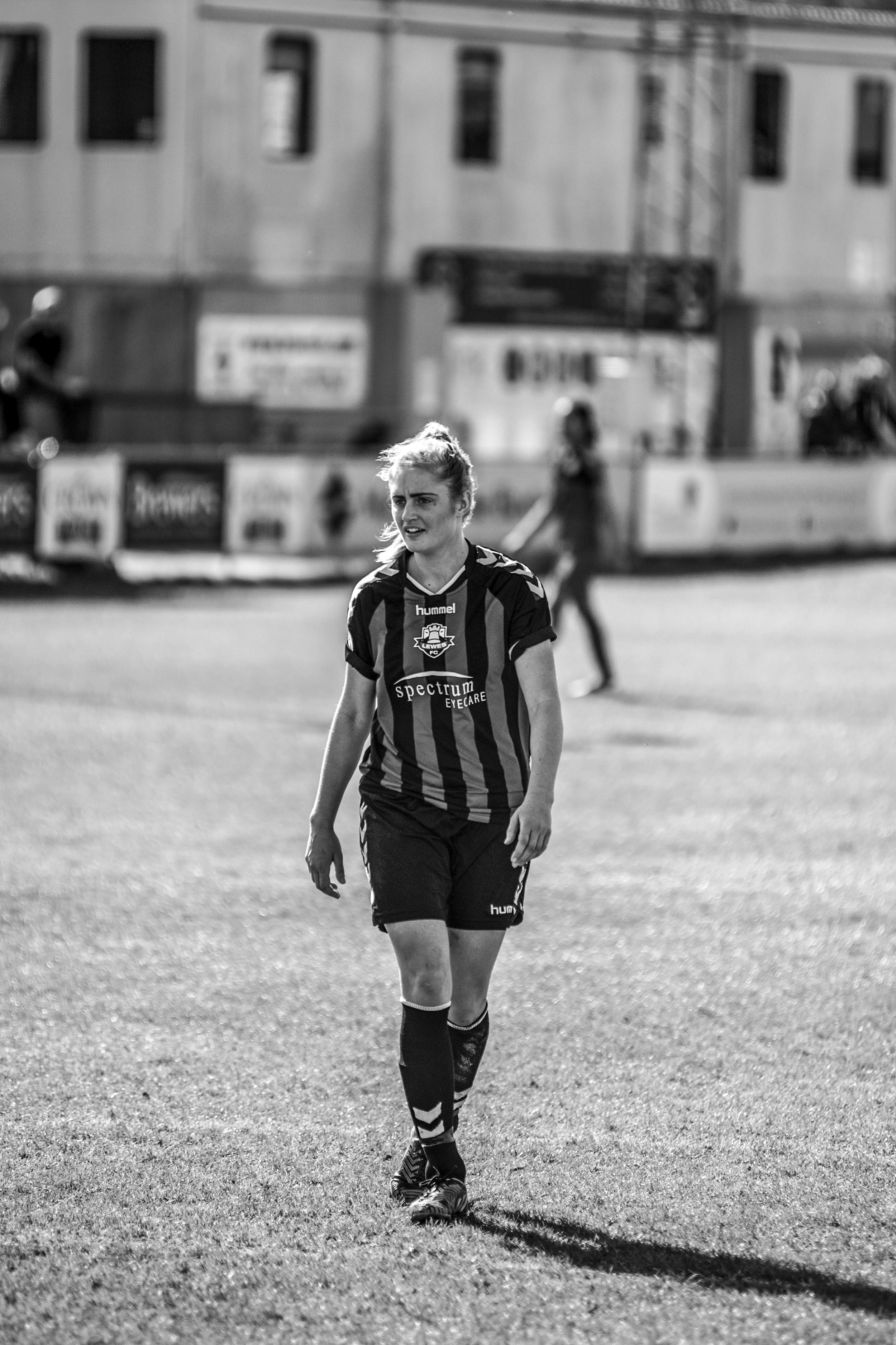 Woman footballer walking.jpg