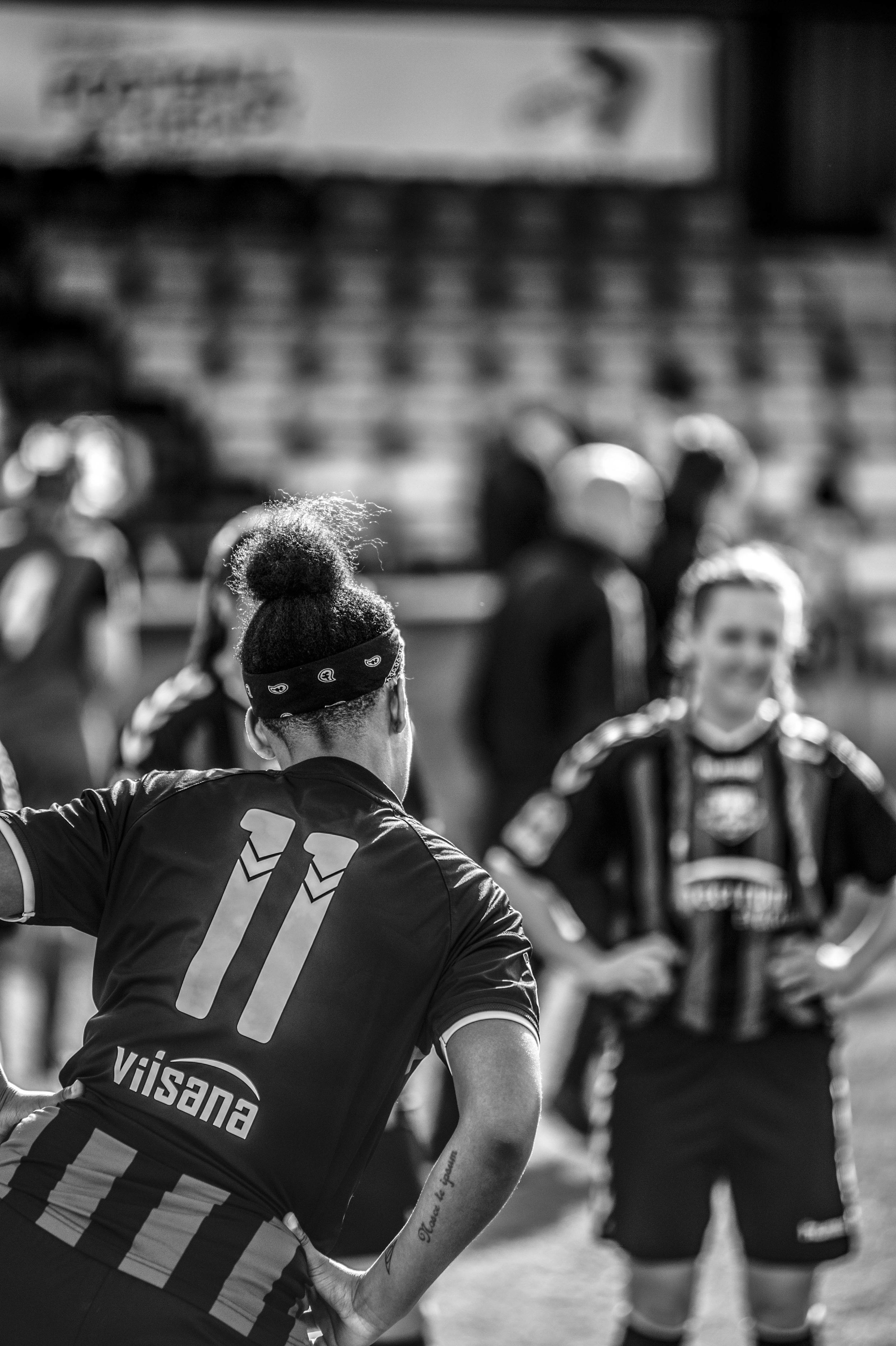 Women footballers stretching.jpg