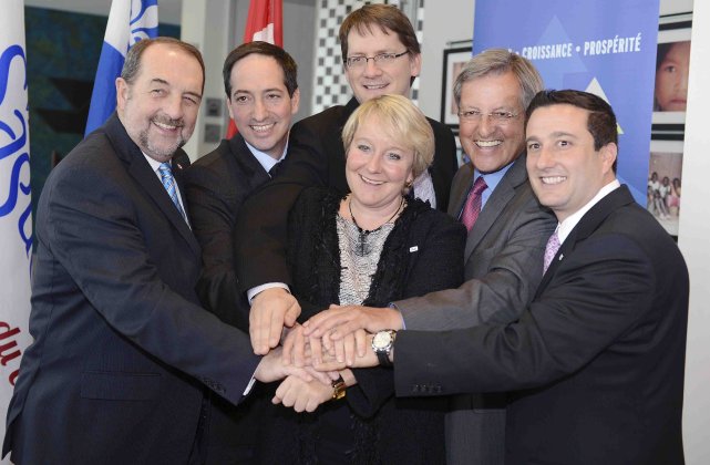 Ministers Denis Lebel, Stéphane Bédard and Sylvain Gaudreault join Martine Turcotte, Vice Chair, Québec for Bell, Mayor Jean Tremblay and John DiNardo, President of Nordia at the announcement.