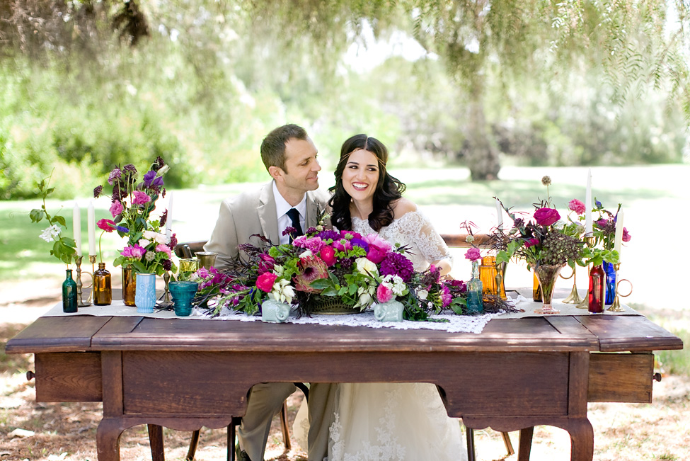 Berry bohemian sweetheart table by San Diego florist, Compass Floral.