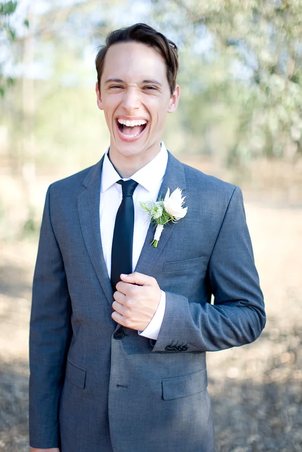 Blushing bride protea boutonniere by San Diego florist, Compass Floral.