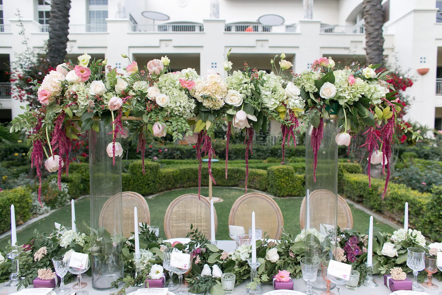 Elevated florals & garland centerpiece by San Diego wedding florist, Compass Floral.
