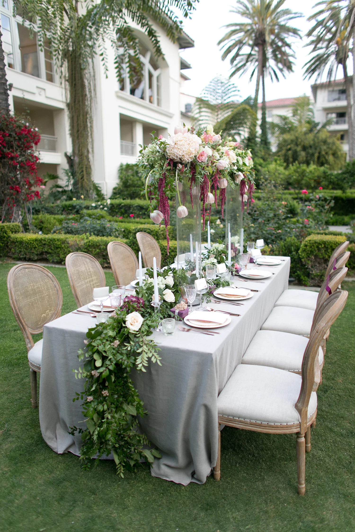 Elevated florals & garland centerpiece by San Diego wedding florist, Compass Floral.