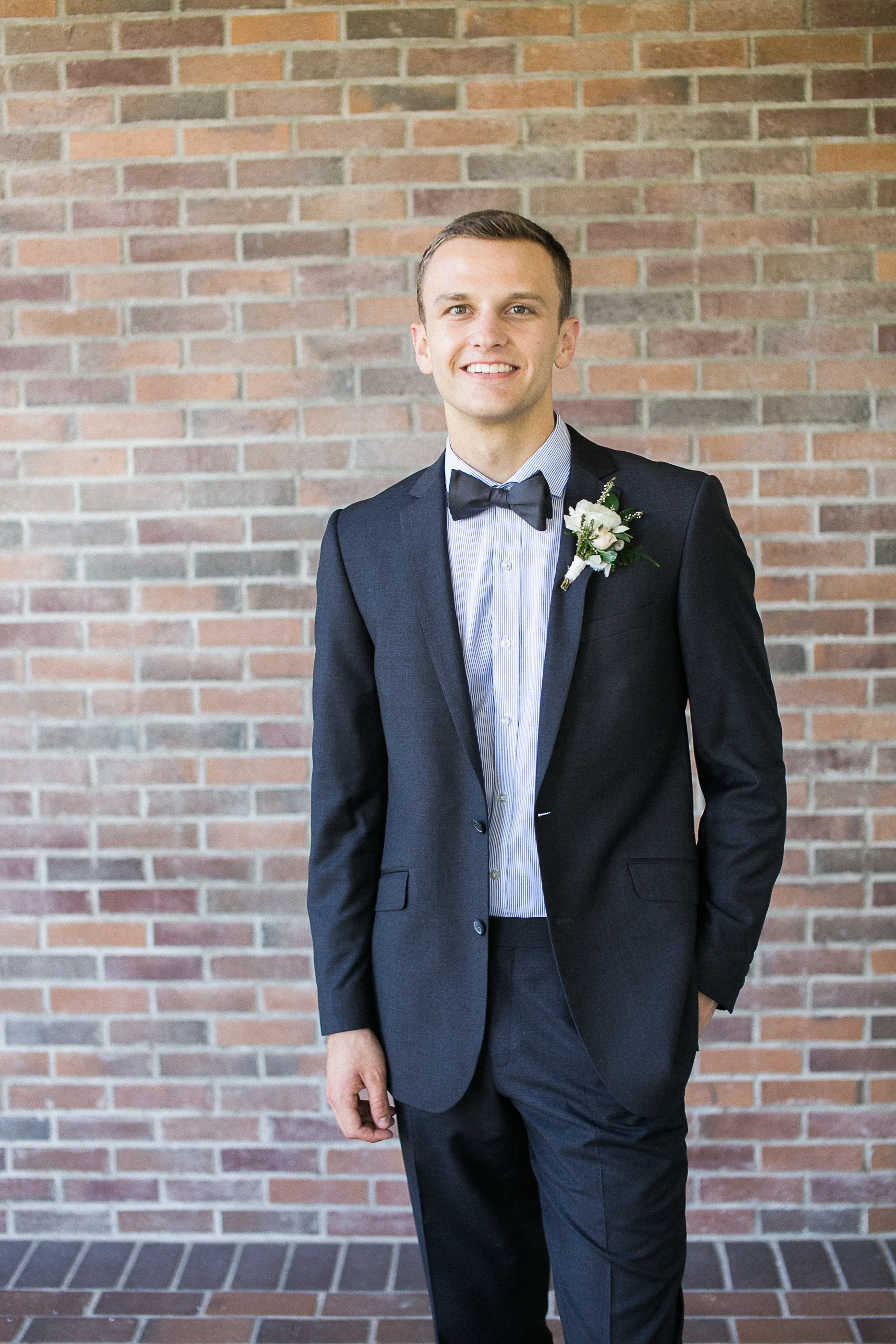 White ranunculus boutonniere by San Diego wedding florist, Compass Floral.