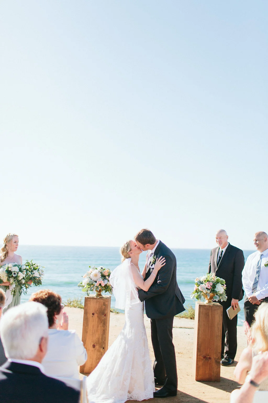 Blush & ivory Sunset Cliffs beach wedding ceremony | La Jolla Weddings | Compass Floral Design | Wedding Florist in San Diego and Southern California | Aga Jones Photography