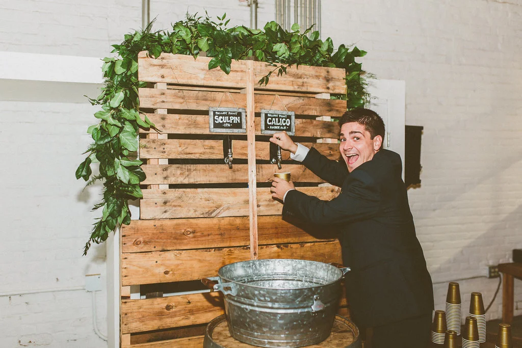 Garland & brass wedding at Moniker Warehouse by San Diego wedding florist, Compass Floral.