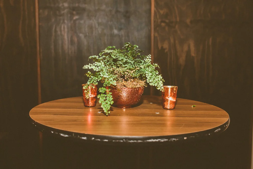 Garland & brass wedding at Moniker Warehouse by San Diego wedding florist, Compass Floral.