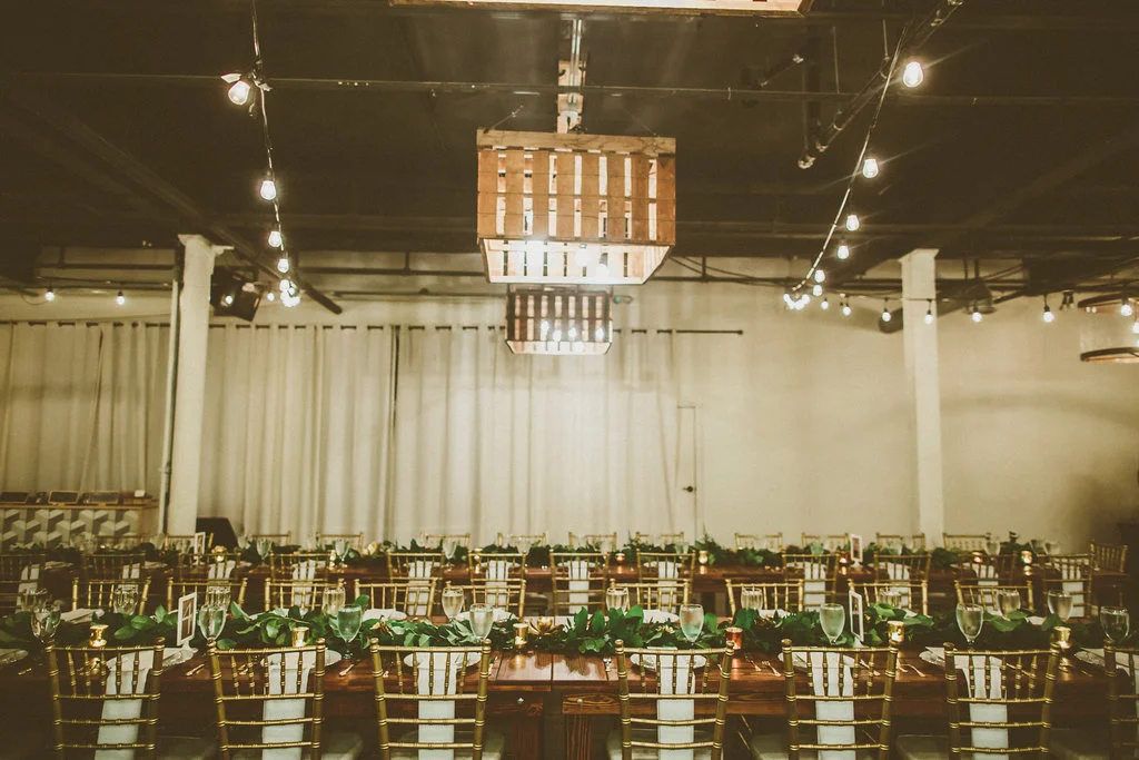 Garland & brass wedding at Moniker Warehouse by San Diego wedding florist, Compass Floral.