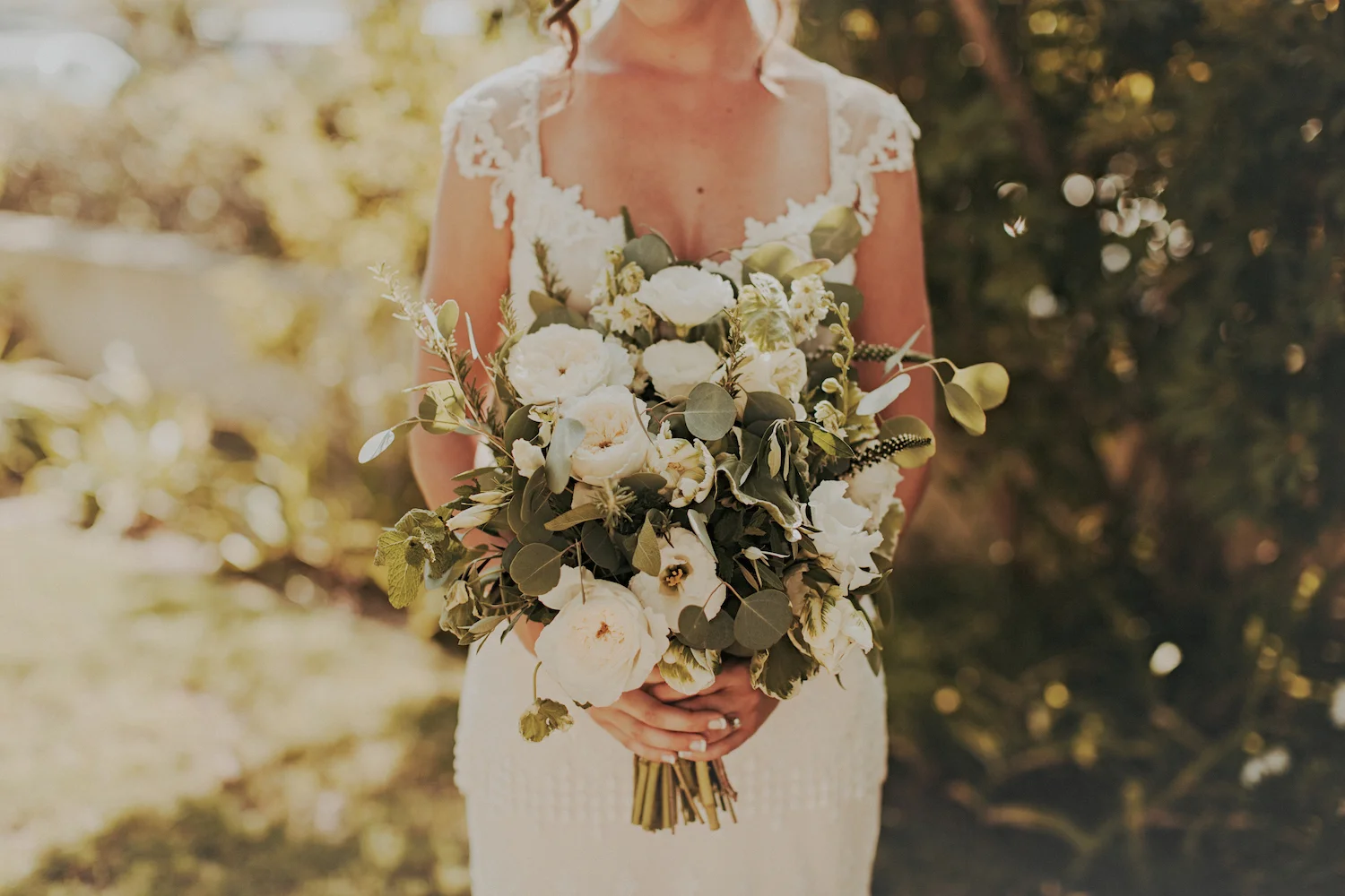 White garden rose & herb bridal bouquet by San Diego wedding florist, Compass Floral.