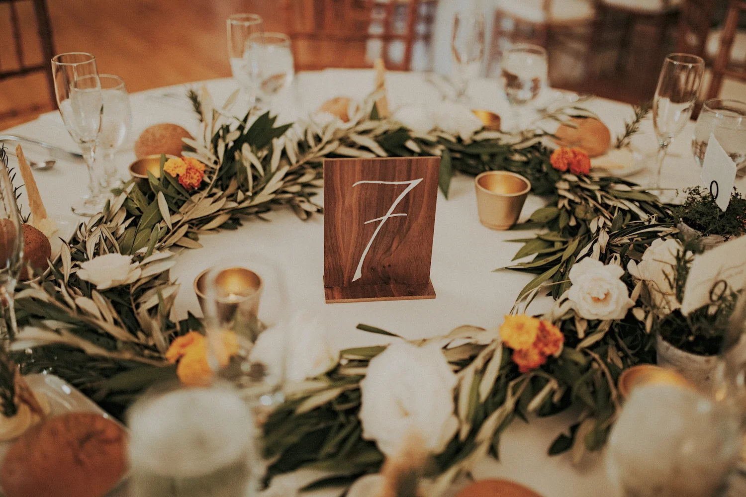 La Jolla Womans Club rosemary & bay leaf garland centerpiece by San Diego wedding florist, Compass Floral.