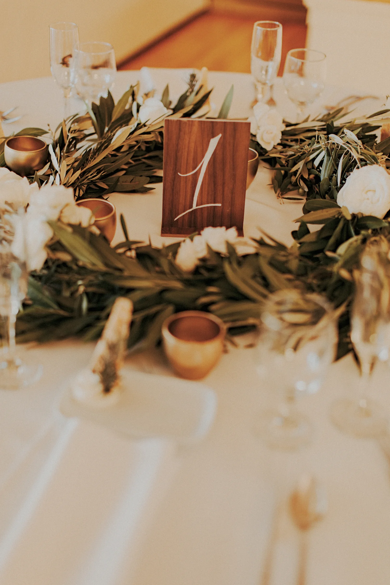 La Jolla Womans Club rosemary & bay leaf garland centerpiece by San Diego wedding florist, Compass Floral.