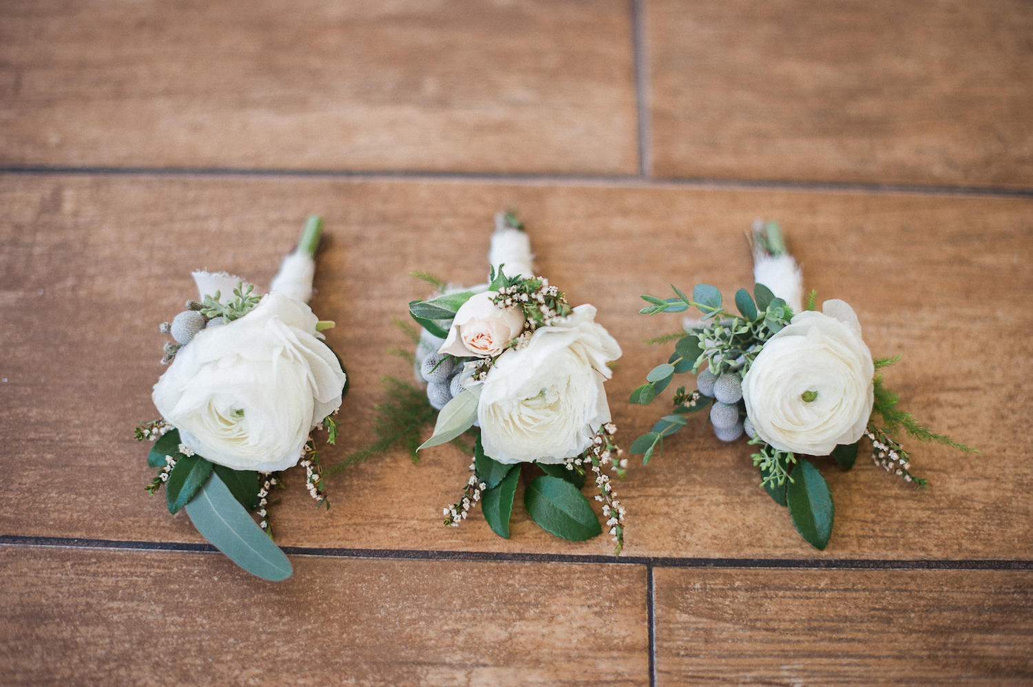 Carmel Mountain Ranch Country Club Ivory ranunculus boutonnieres by San Diego wedding florist, Compass Floral. Brandi Welles Photography.