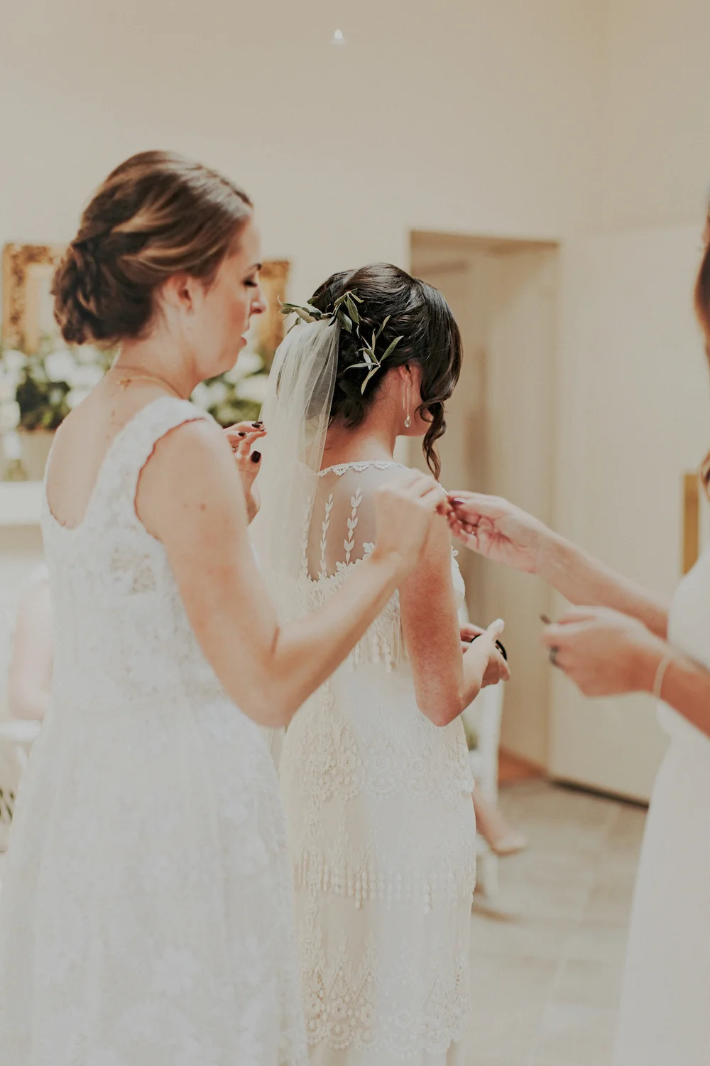 Olive branch hair flowers by San Diego wedding florist, Compass Floral.