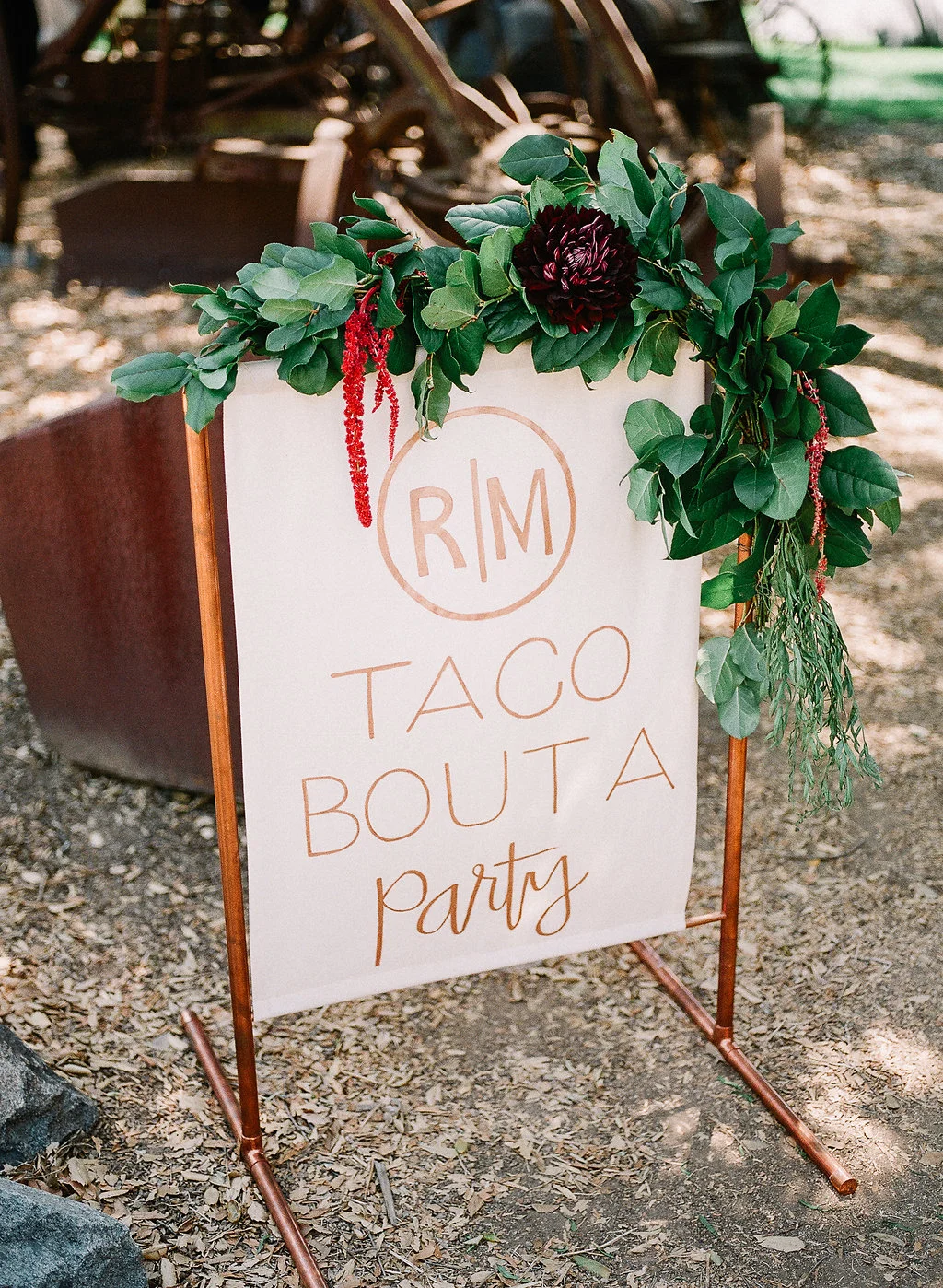 Monogrammed wedding taco sign with floral garland by Compass Floral | Fallbrook Treehouse, Fallbrook