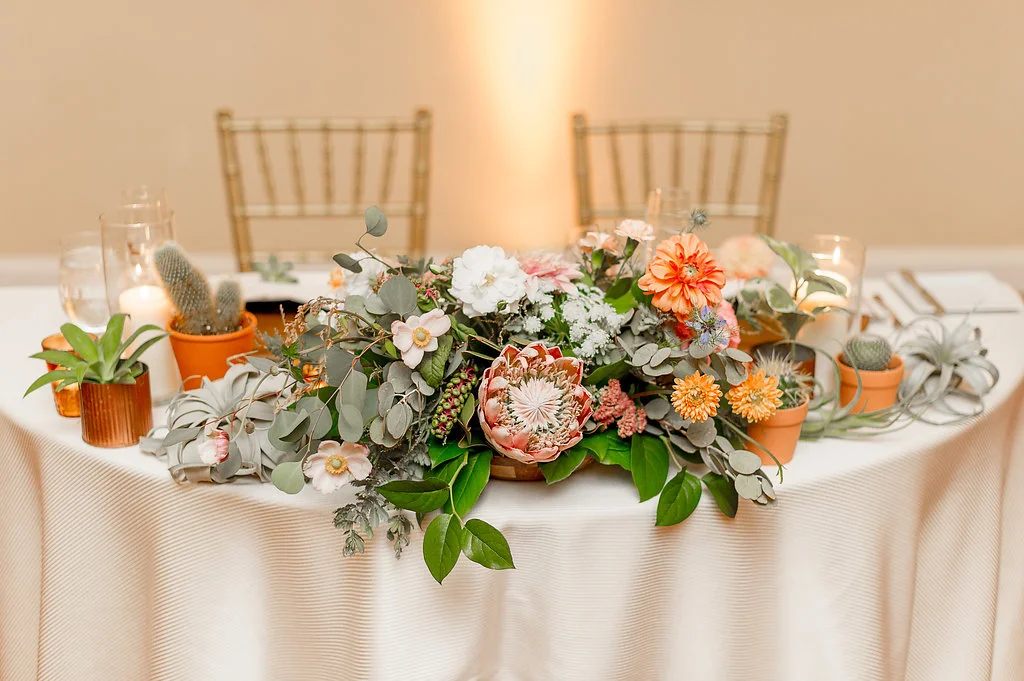 Desert bohemian cactus & floral sweetheart table centerpiece by Compass Floral | Estancia Hotel & Spa, La Jolla.