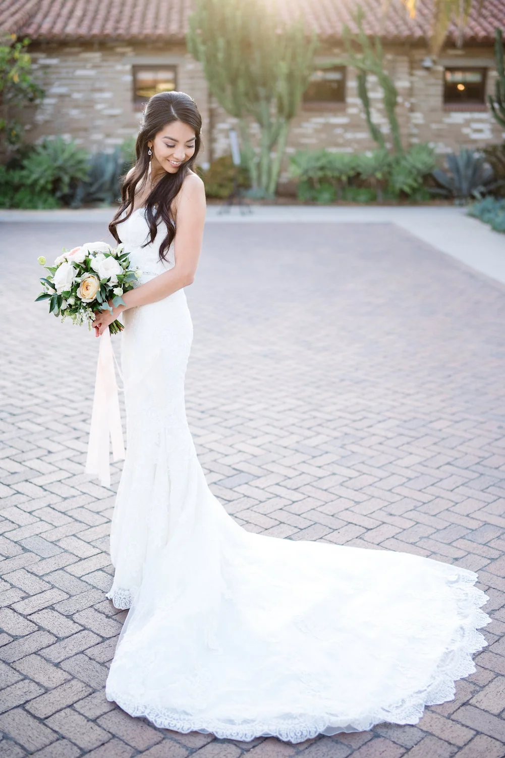 Ivory & blush bridal bouquet with trailing ribbons by Compass Floral | Estancia Hotel & Spa, La Jolla.