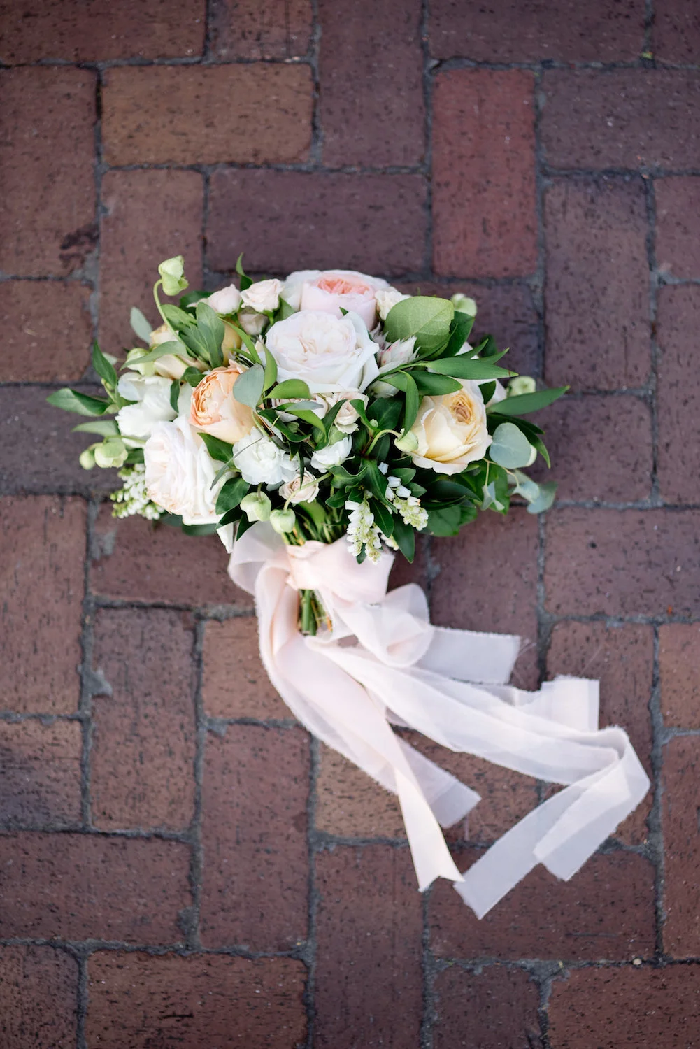 Ivory & blush bridal bouquet with trailing ribbons by Compass Floral | Estancia Hotel & Spa, La Jolla.