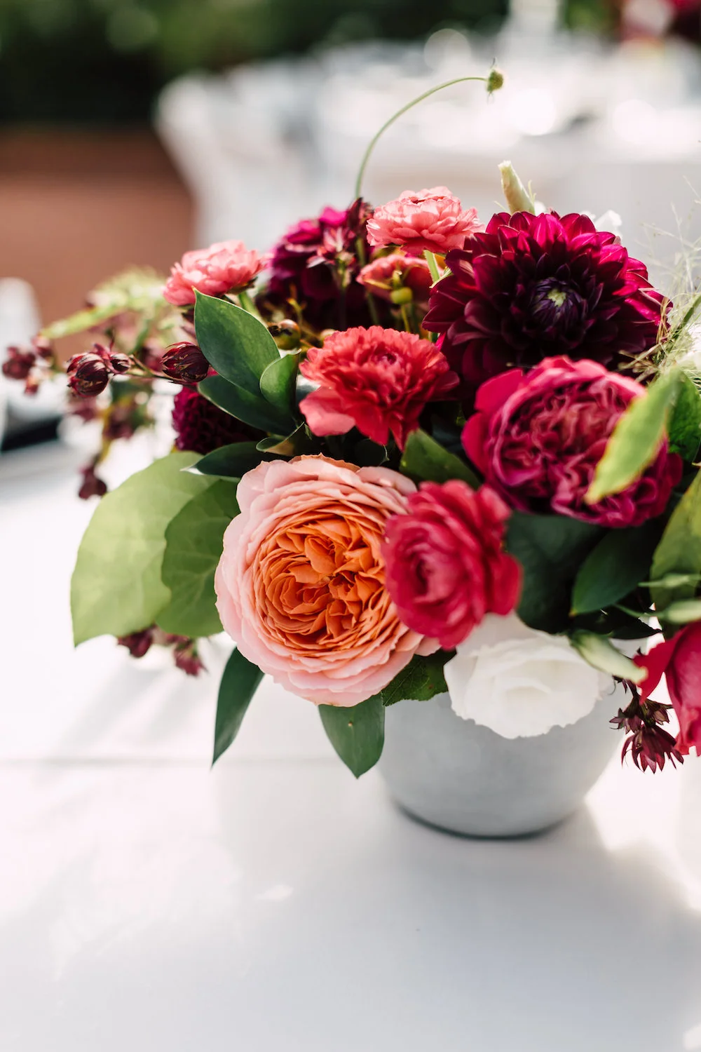 Classic, modern jewel tone centerpiece by Compass Floral. Venue: The Darlington House, La Jolla. Photographer: Plum & Oak