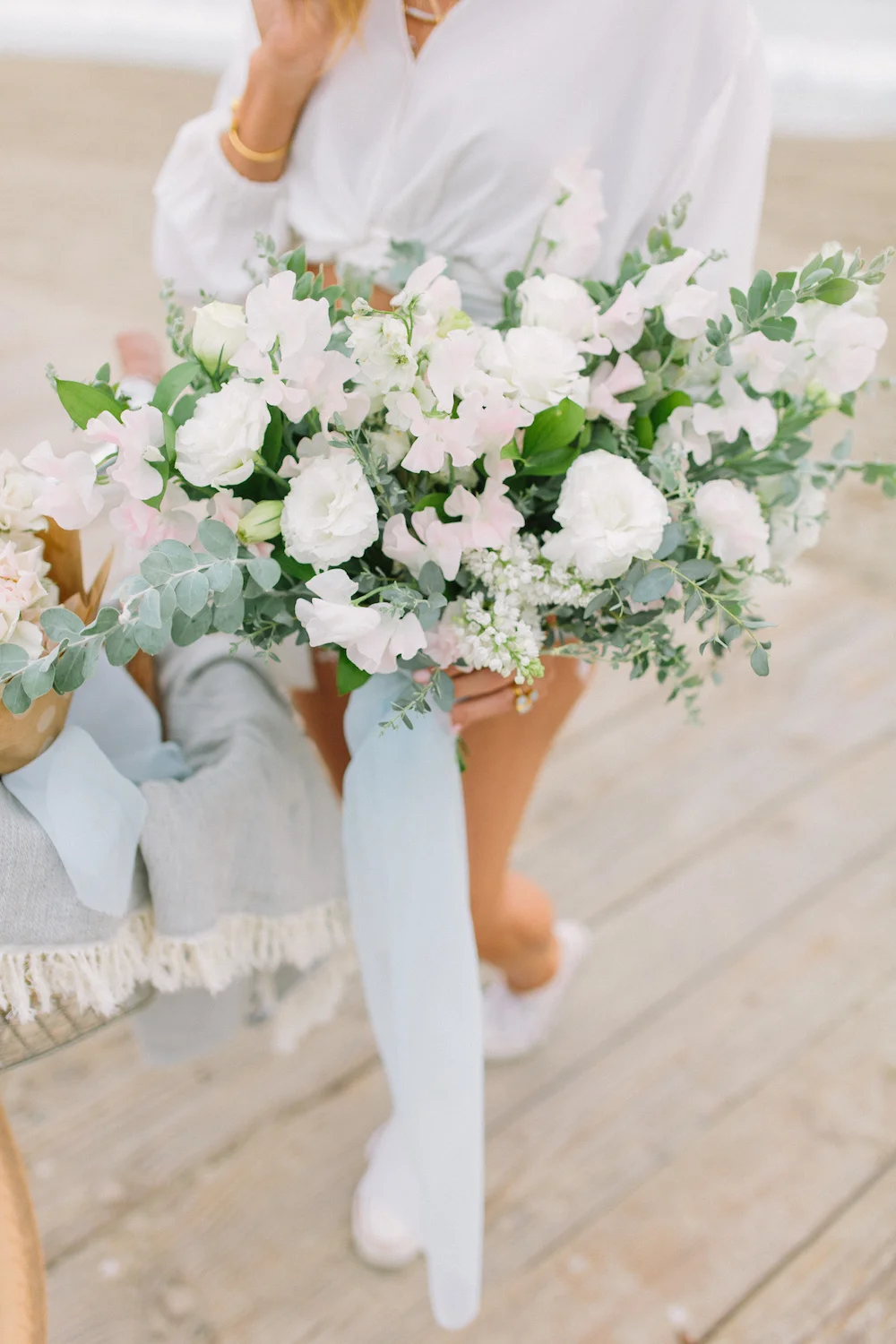 Bachelor contestant Sarah Vendal with summer bouquet of lilac, sweet pea and lisianthus by Compass Floral. Design & Planning // Events by Talissa Photographer // Garrett Richardson