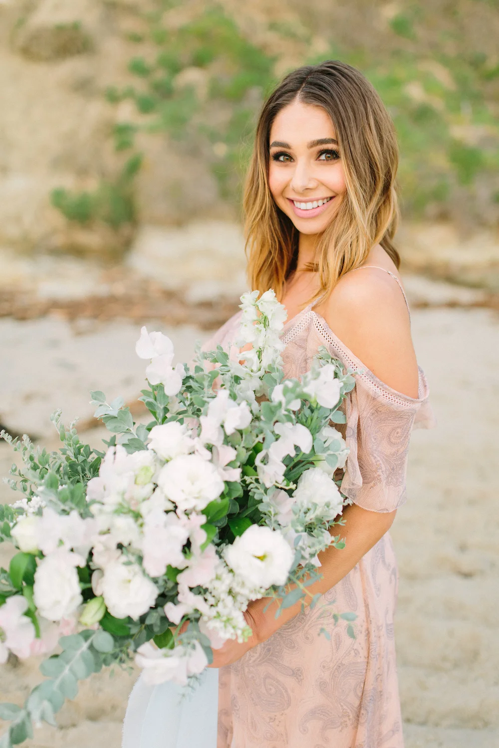 Bachelor contestant Sarah Vendal with summer bouquet of lilac, sweet pea and lisianthus by Compass Floral.Bachelor contestant Sarah Vendal summer fun beach styled shoot. Bouquet by Compass Floral. Design & Planning // Events by Talissa Photographer // Garrett Richardson