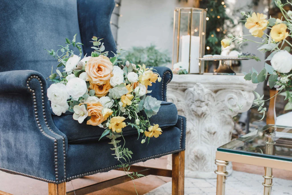 Blue velvet chair with bridal bouquet | Franciscan Gardens, San Juan Capistrano | Compass Floral | Wedding Florist in San Diego and Southern California | Jessica Jaccarino Photography