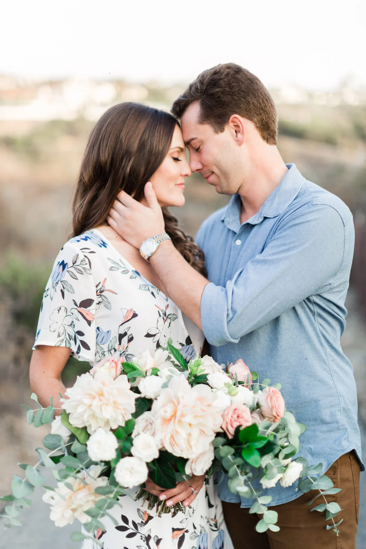 Classic blush dahlia, white rose and eucalyptus bouquet for down to earth beach engagement photo session | Newport Beach, CA | Compass Floral | Wedding Florist in San Diego and Southern California | Cavin Elizabeth Photography