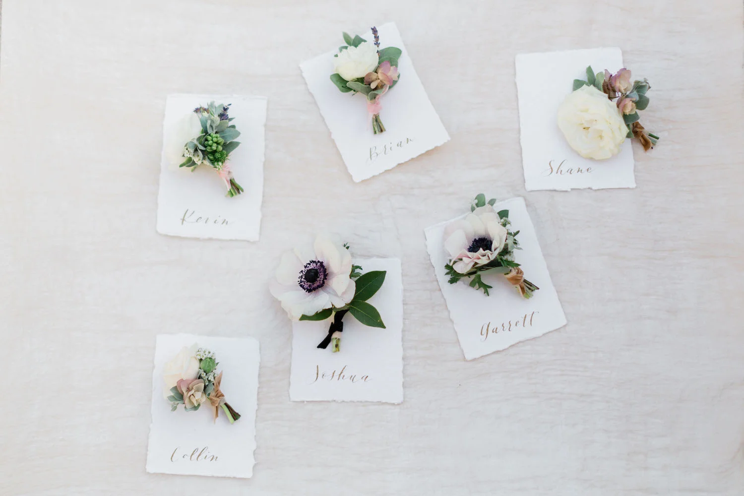White and blush anemone, rose, ranunculus boutonniere | The Inn at Rancho Santa Fe | Compass Floral | Wedding Florist in San Diego and Southern California | Devon Donnahoo Photography