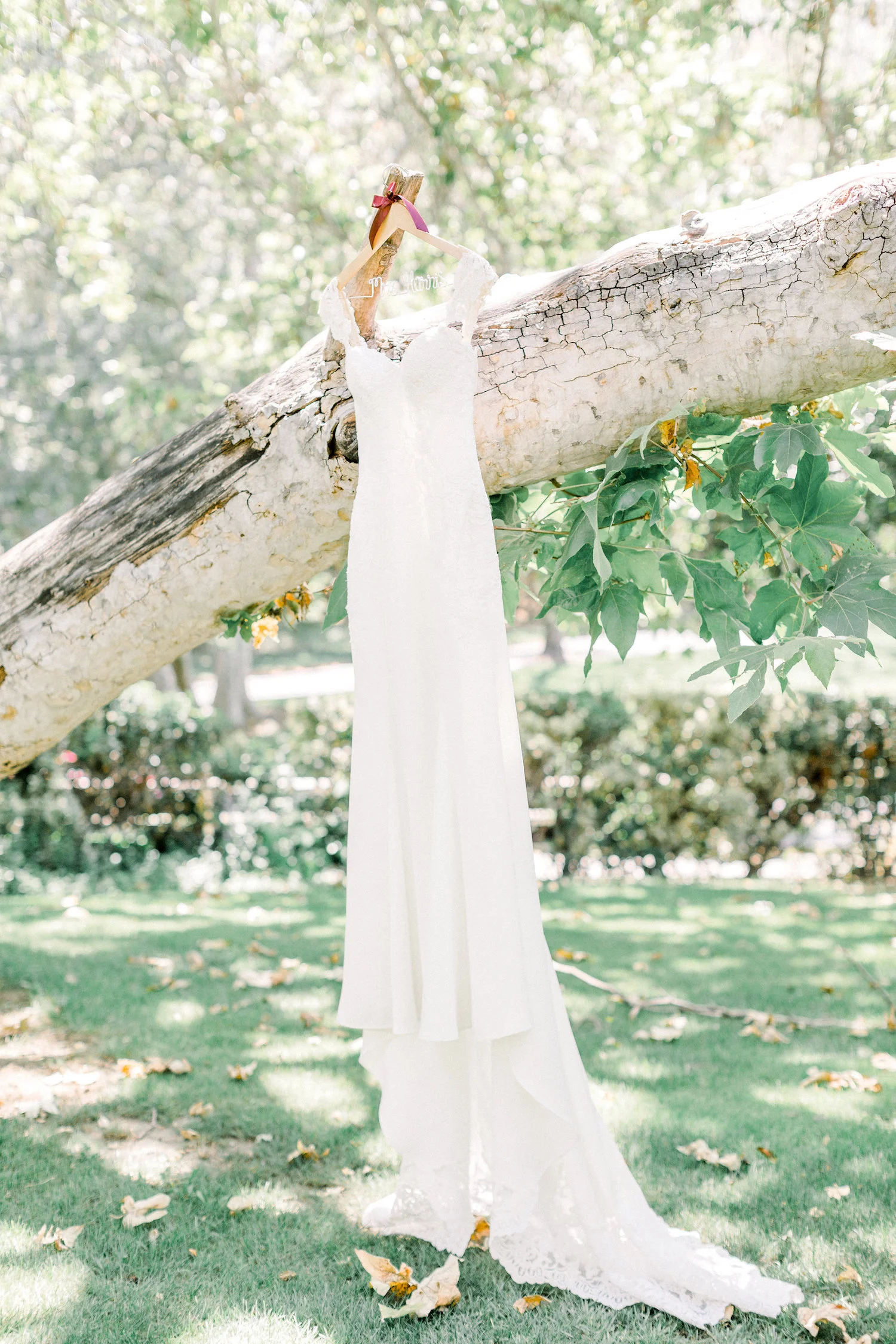 Hanging wedding gown photo | Temecula Creek Inn | Compass Floral | Wedding Florist in San Diego and Southern California | Pauline Conway Photography