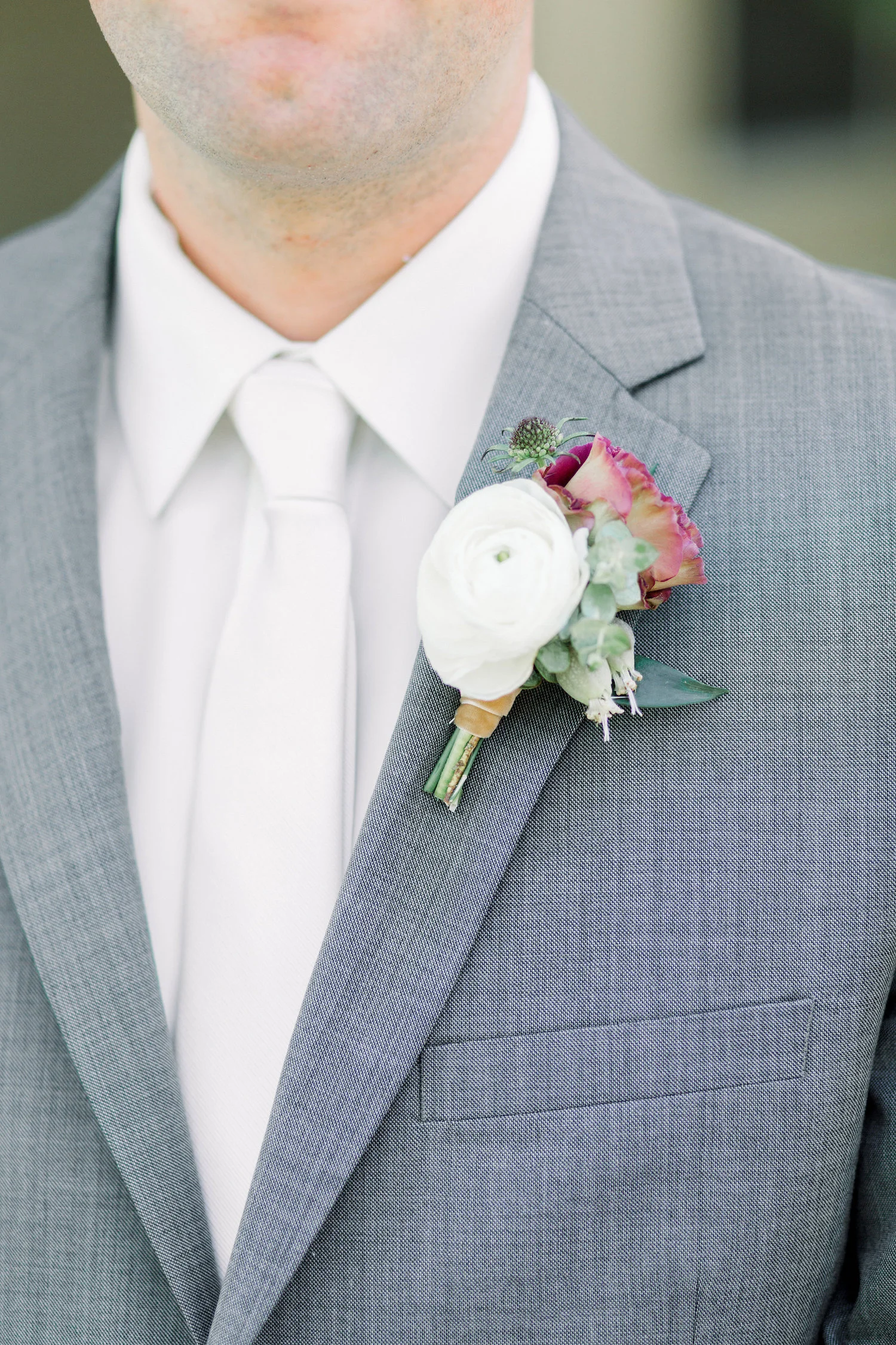 White ranunculus and lisianthus boutonniere | Temecula Creek Inn | Compass Floral | Wedding Florist in San Diego and Southern California | Pauline Conway Photography
