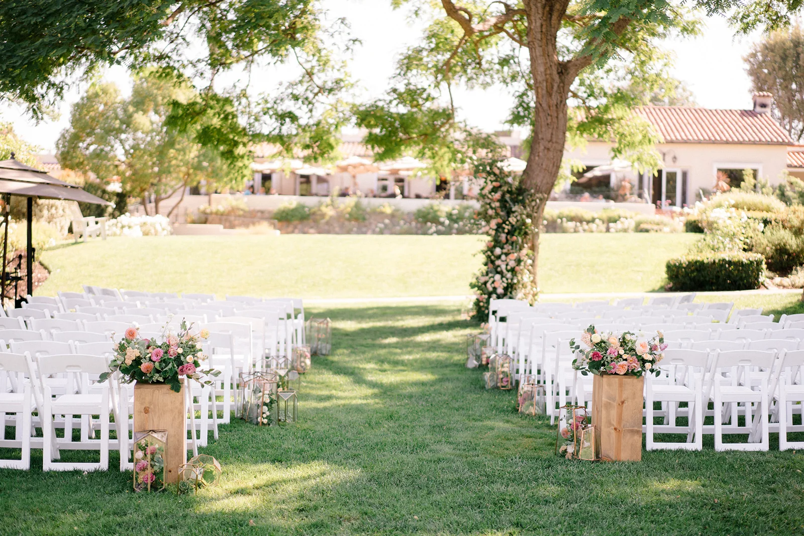 Outdoor wedding ceremony under tree | The Inn at Rancho Santa Fe | Compass Floral | Wedding Florist in San Diego and Southern California | Shane and Lauren Photography