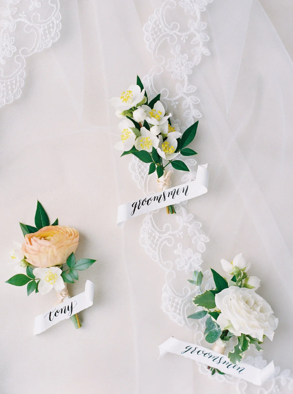 Elegant mock orange and ranunculus boutonnieres | San Diego | Compass Floral | Wedding Florist in San Diego and Southern California | Meiwen Wang Photography