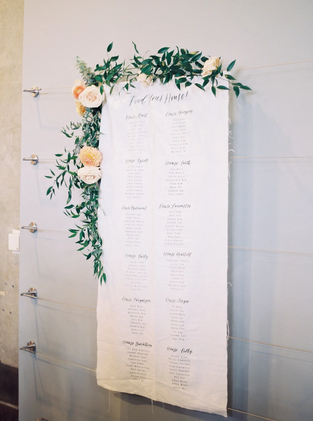 Game of Thrones wedding seating chart with garland | The New Children’s Museum | Compass Floral | Wedding Florist in San Diego and Southern California | Meiwen Wang Photography