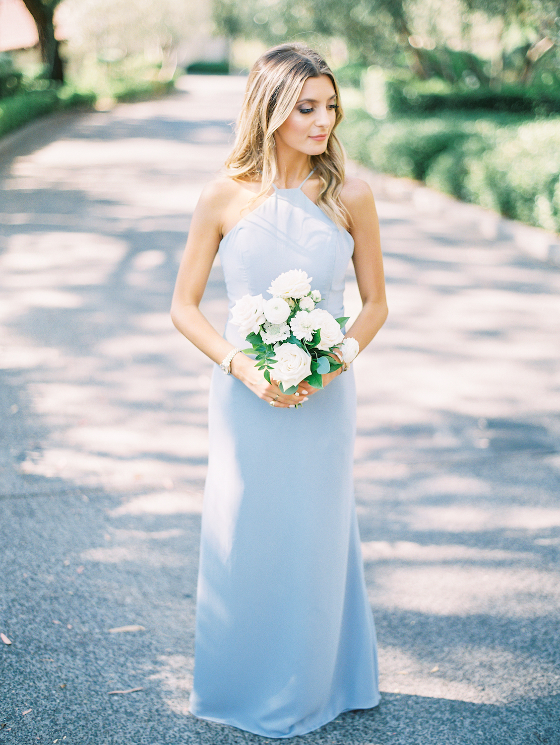 Bridesmaid in light blue dress with white flowers | Rancho Bernardo Inn | Compass Floral | Wedding Florist in San Diego and Southern California | Dear Lovers Photography