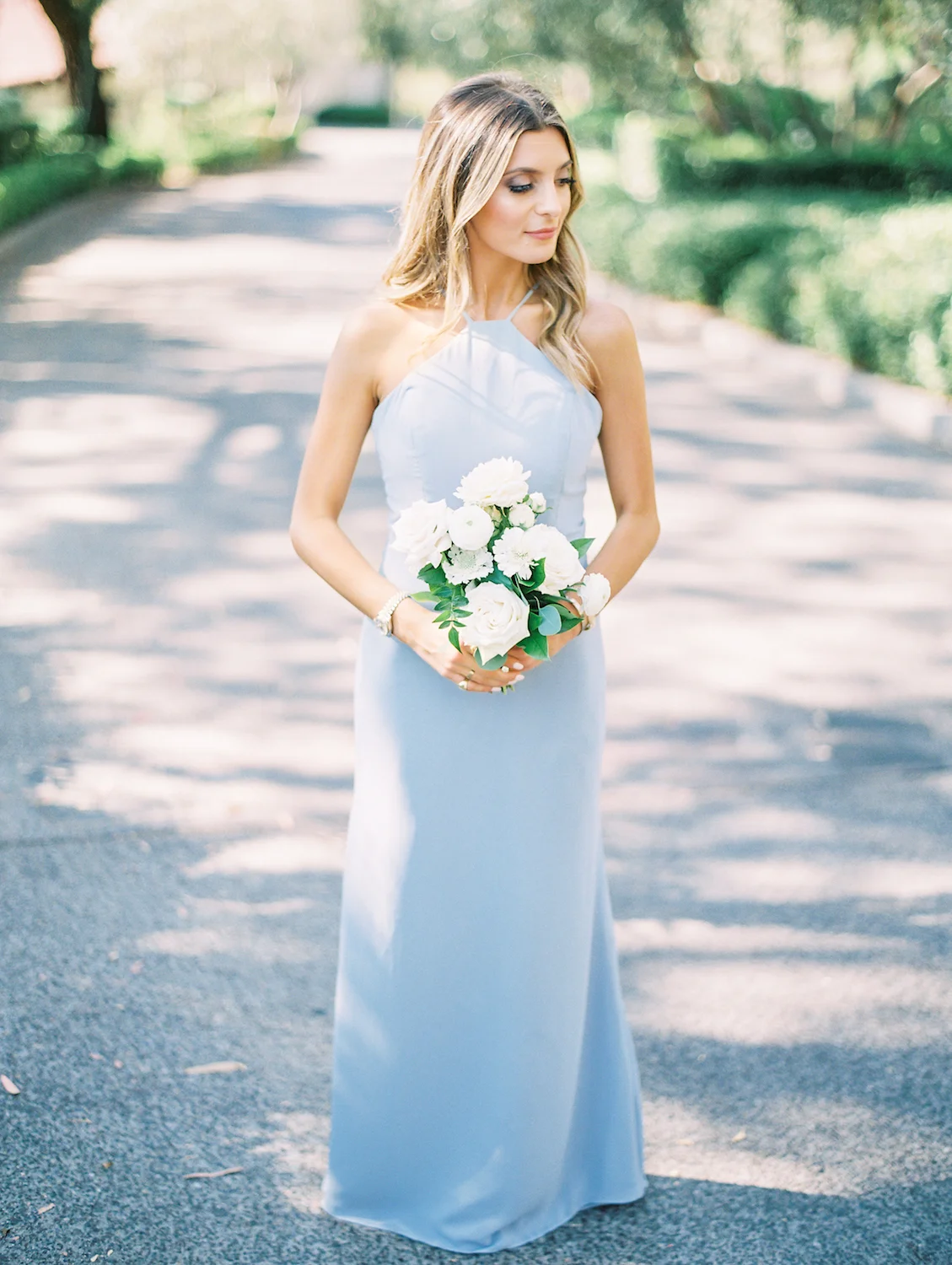 Bridesmaid in light blue dress with white flowers | Rancho Bernardo Inn | Compass Floral | Wedding Florist in San Diego and Southern California | Dear Lovers Photography