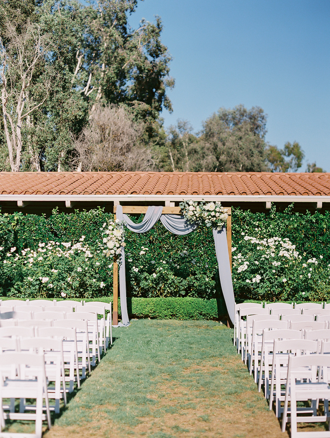 Fabric draped ceremony arch Outdoor bridal portrait with white bridal bouquet | Rancho Bernardo Inn | Compass Floral | Wedding Florist in San Diego and Southern California | Dear Lovers Photography