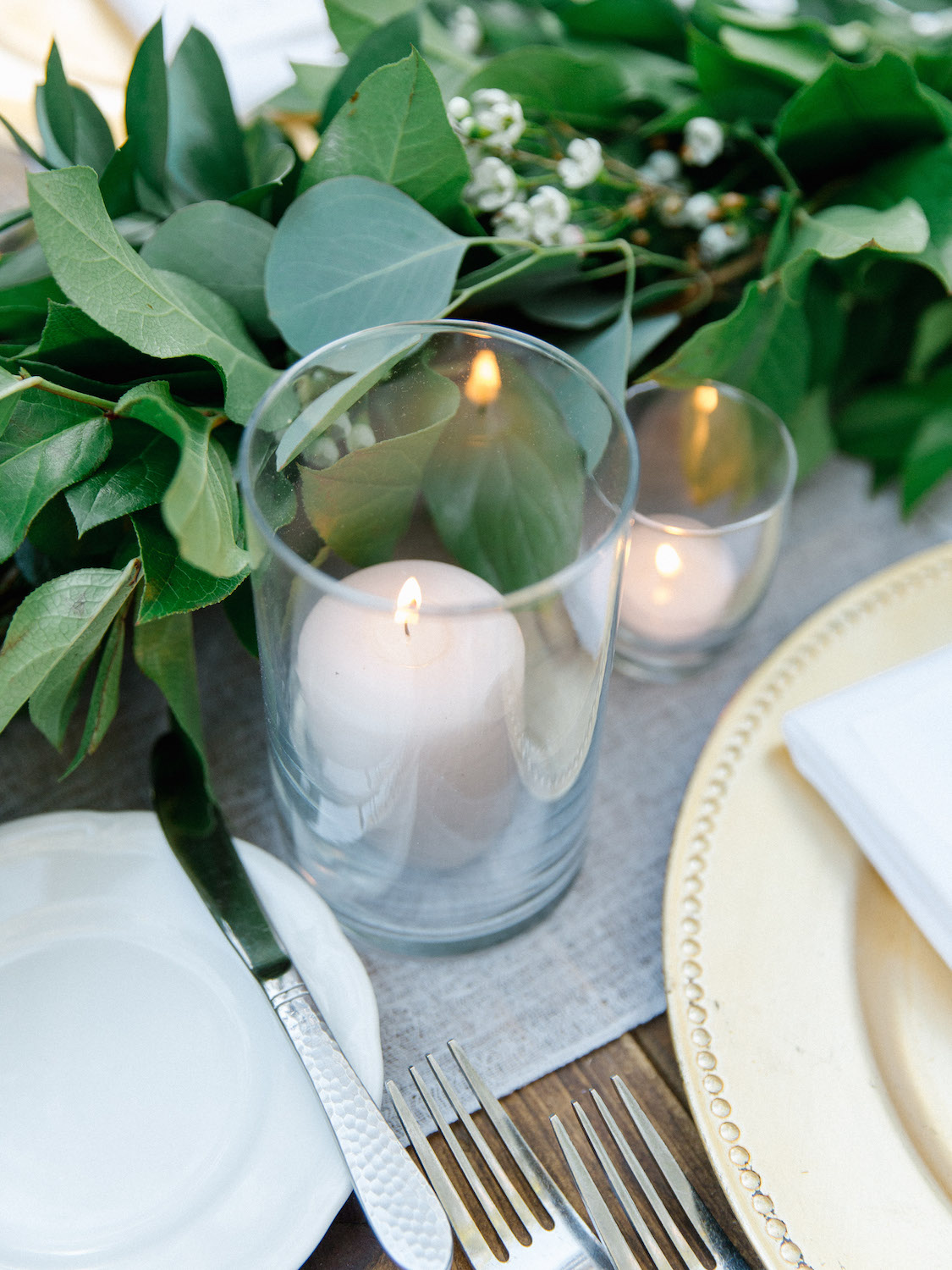 Garland and pillar candle wedding centerpiece | Rancho Bernardo Inn | Compass Floral | Wedding Florist in San Diego and Southern California | Dear Lovers Photography