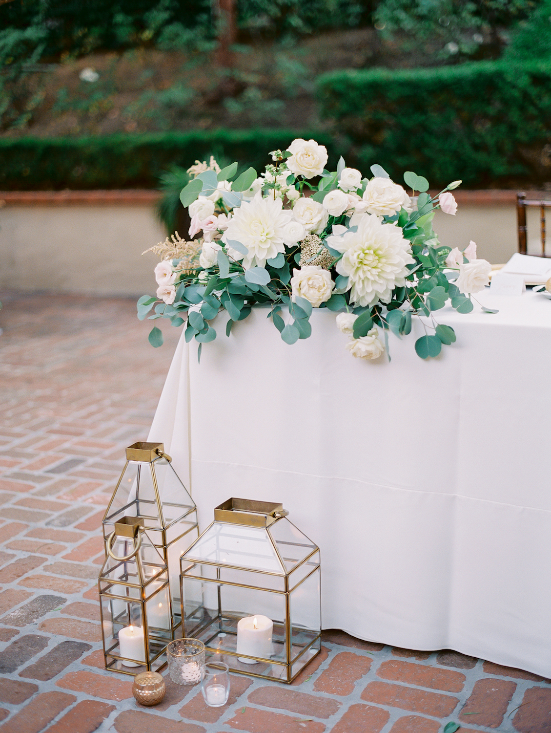 Outdoor sweetheart table with white flowers and lanterns | Rancho Bernardo Inn | Compass Floral | Wedding Florist in San Diego and Southern California | Dear Lovers Photography