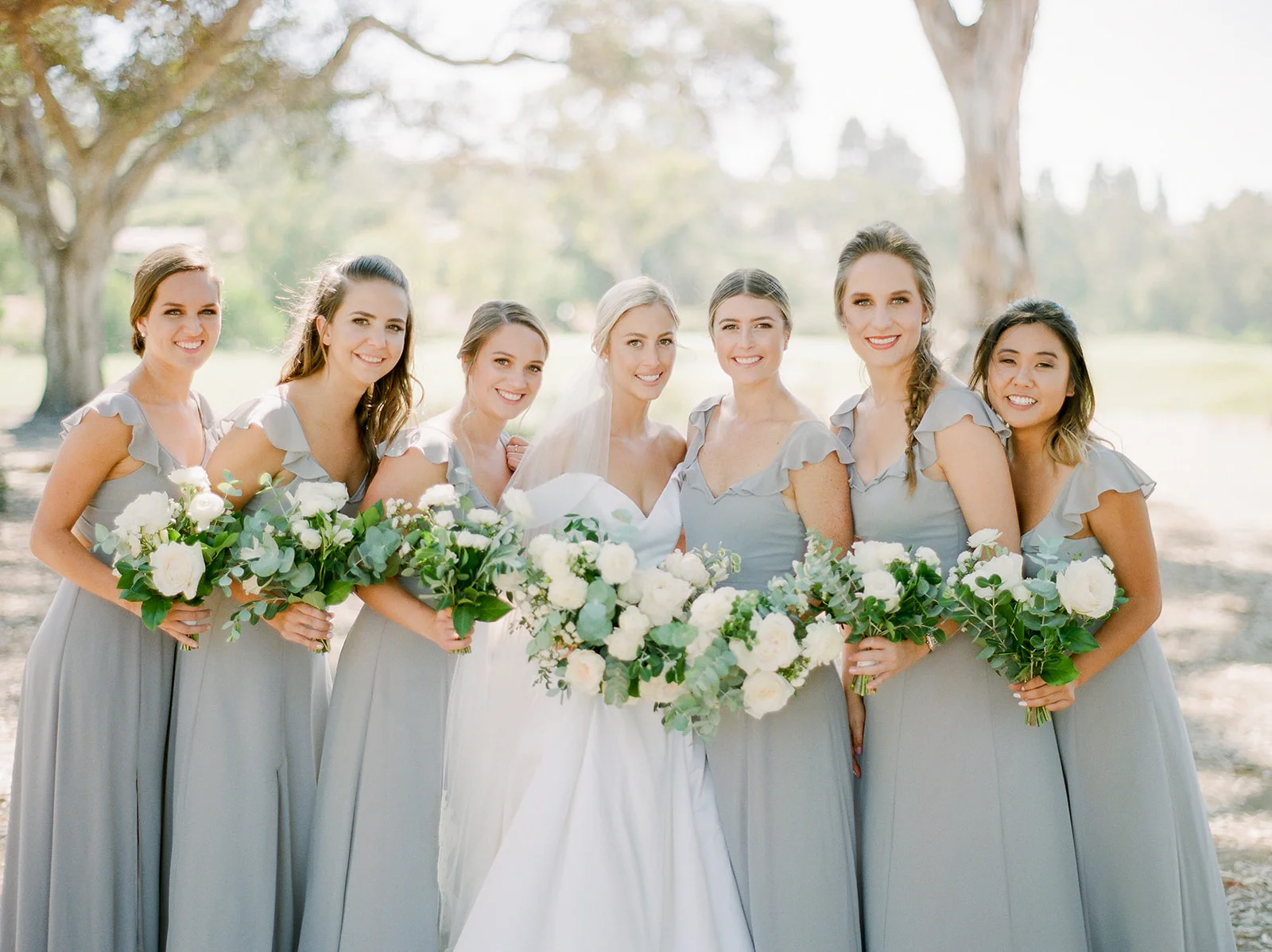 Bridesmaids in gray with lush bouquets | Rancho Santa Fe Golf Club | Compass Floral | Wedding Florist in San Diego and Southern California | Rachael McCall Photography